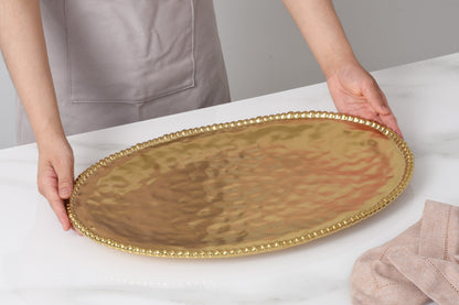 Monte Carlo Large Oval Platter in matte gold high-fired porcelain
Luxury gold beaded-rim oval platter by Pampa Bay
Elegant matte gold porcelain serving platter