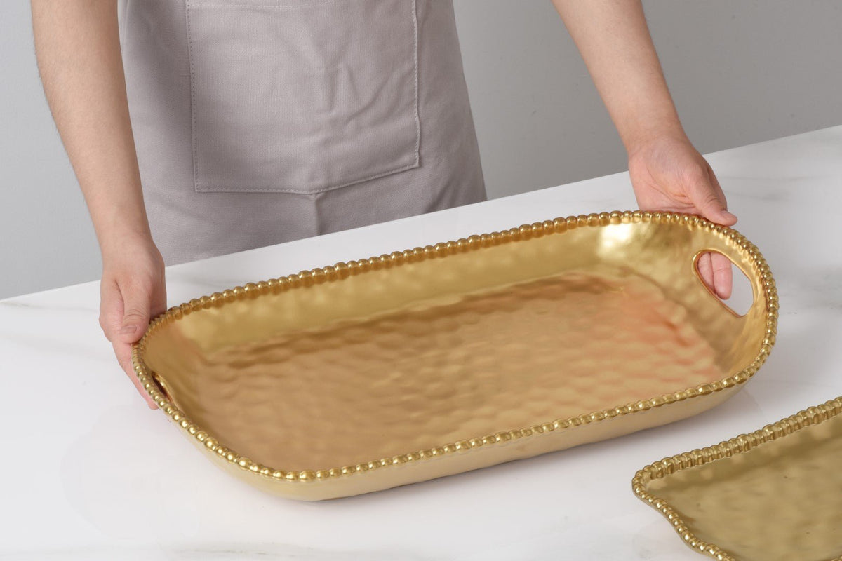 Pampa Bay Monte Carlo Rectangular Tray With Handles on a table held by a person 