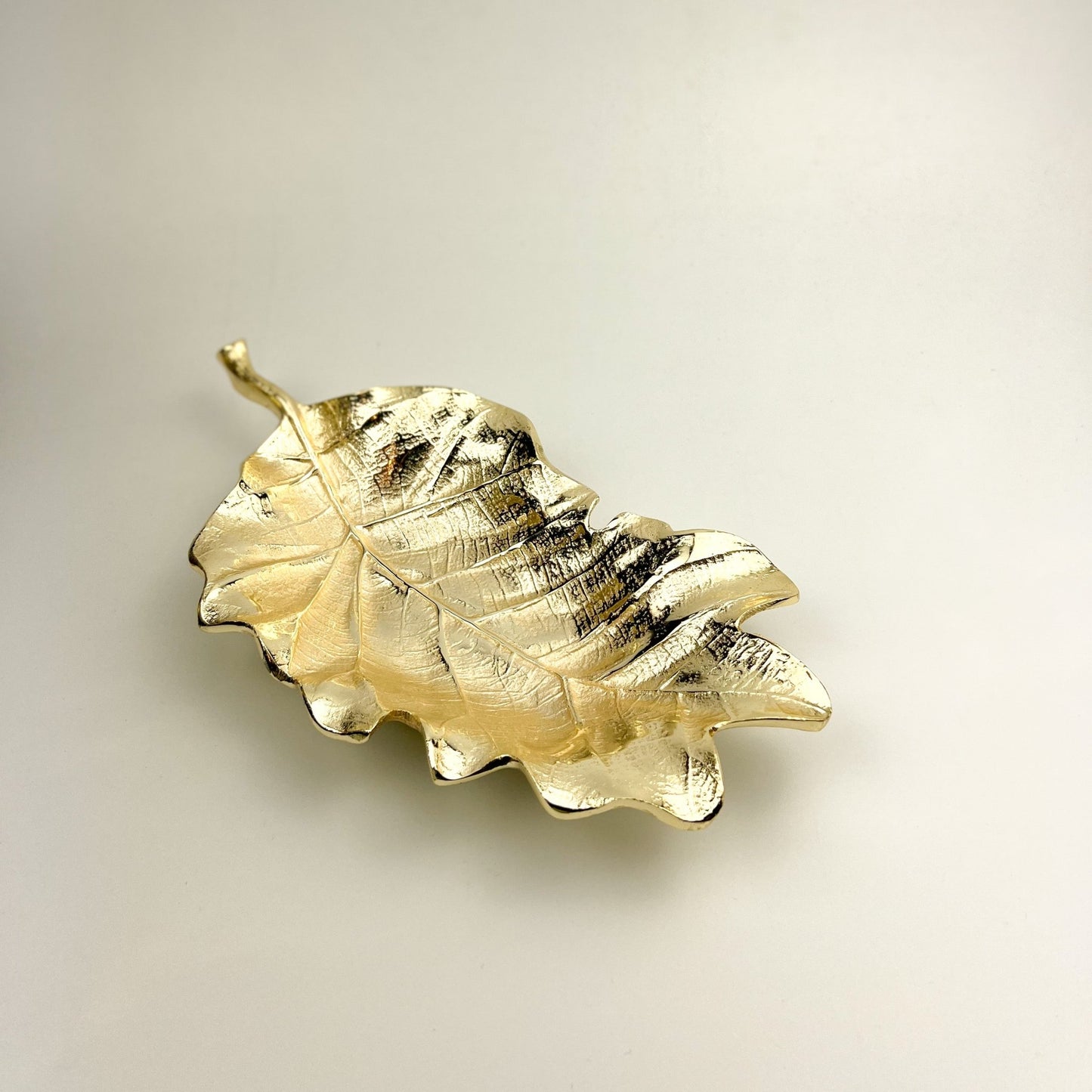 Elysian Gold Leaf Tray — sleek gold leaf shaped decorative tray with refined golden sheen for sideboards and coffee tables