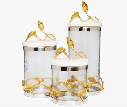 Luxury glass canisters with marble lids and gold leaf accents
Elegant gold vine and leaf kitchen jars for coffee and tea storage
Set of decorative glass storage jars with gold detailing
Modern kitchen countertop decor glass canisters with gold finish