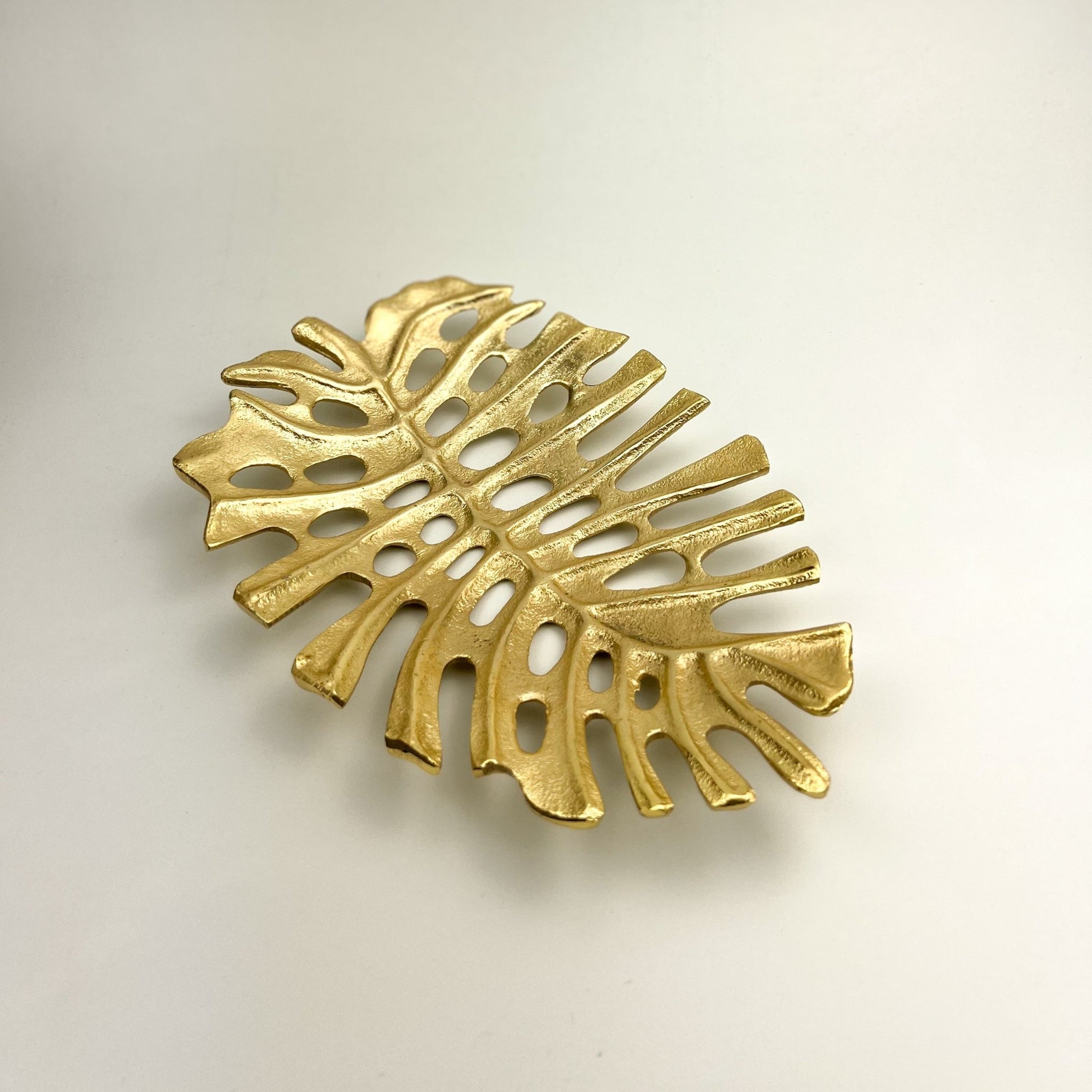 Solara Gold Leaf Tray — hand-finished gold leaf shaped tray with smooth radiant surface, gold decorative tray and table centrepiece UK